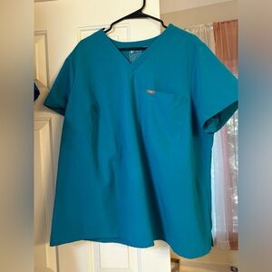 Figs one pocket top in Caribbean blue. Size 3Xl